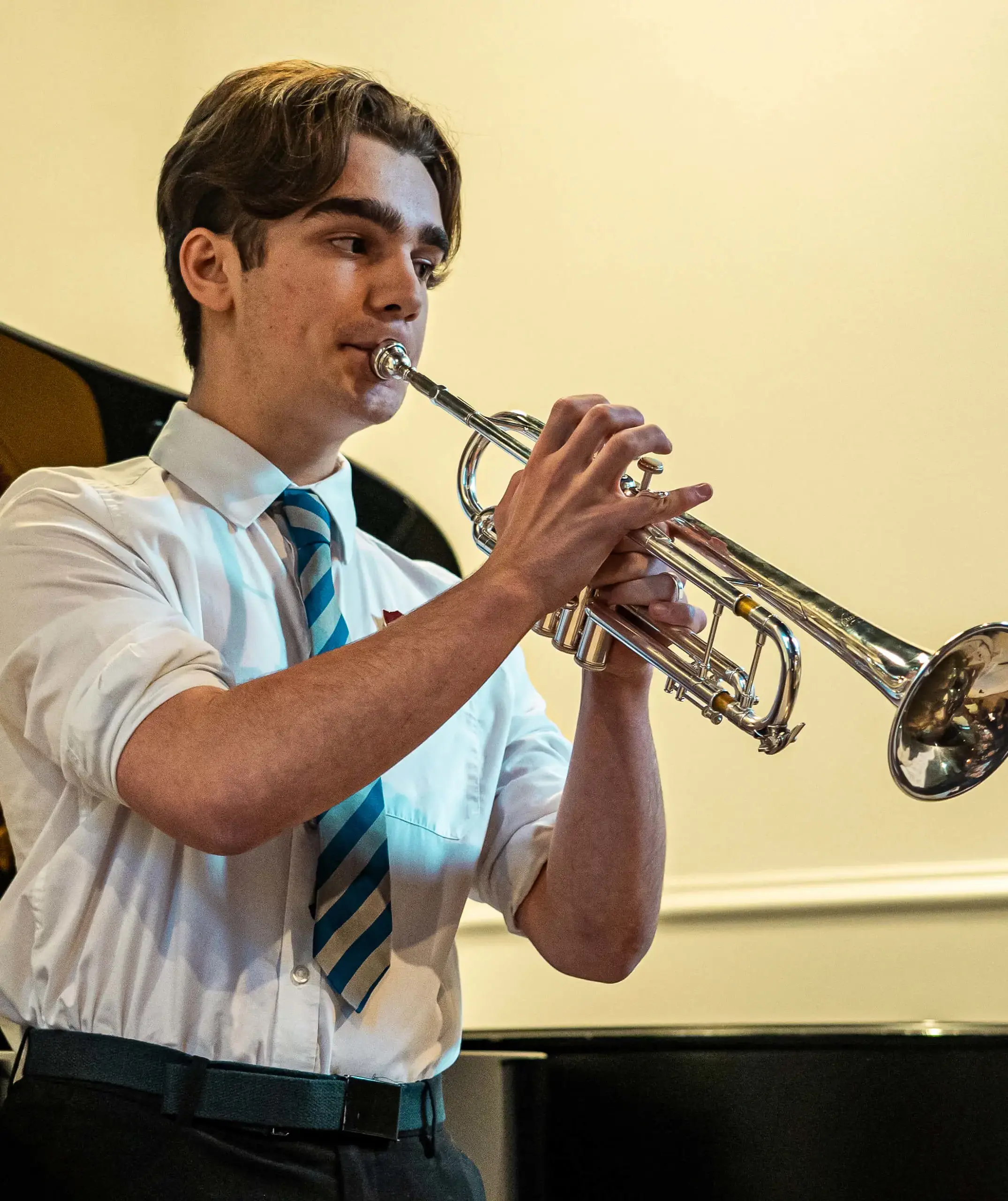 St. Mary's Music School pupil playing a trumpet