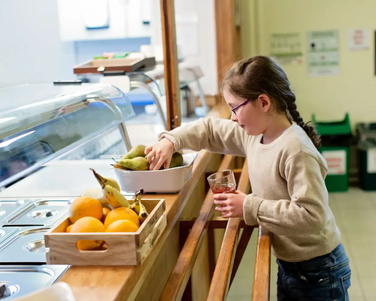 A boarding school pupil in the cafeteriaContent Page Image