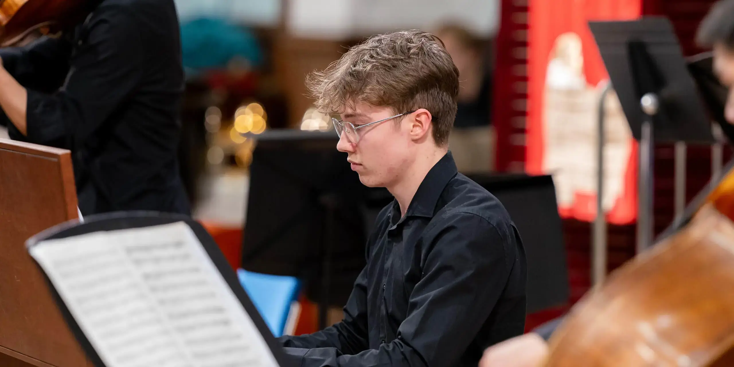 Pupil at St Mary's Music School playing piano