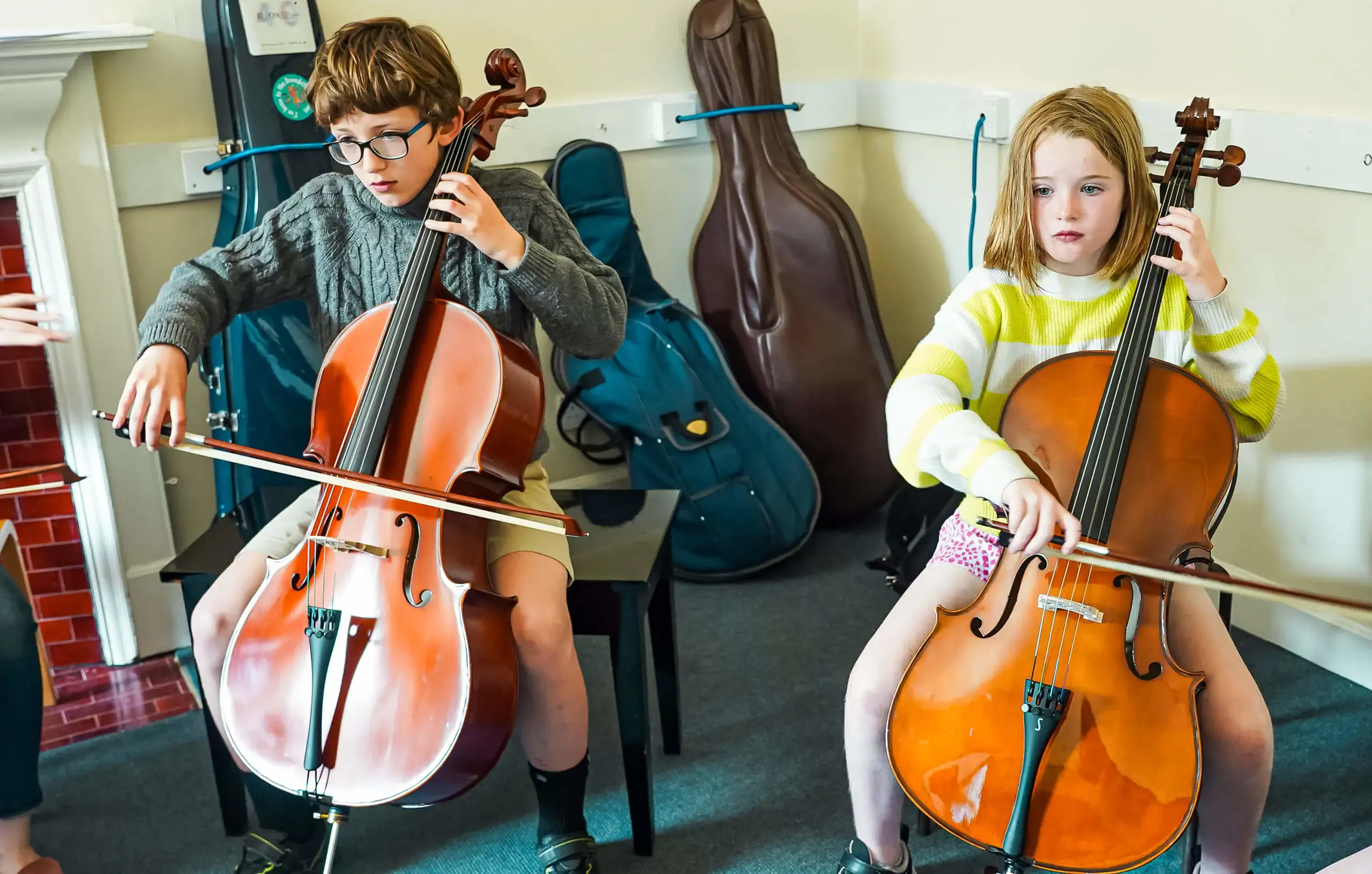 Saturday Music School pupils in a cello lesson