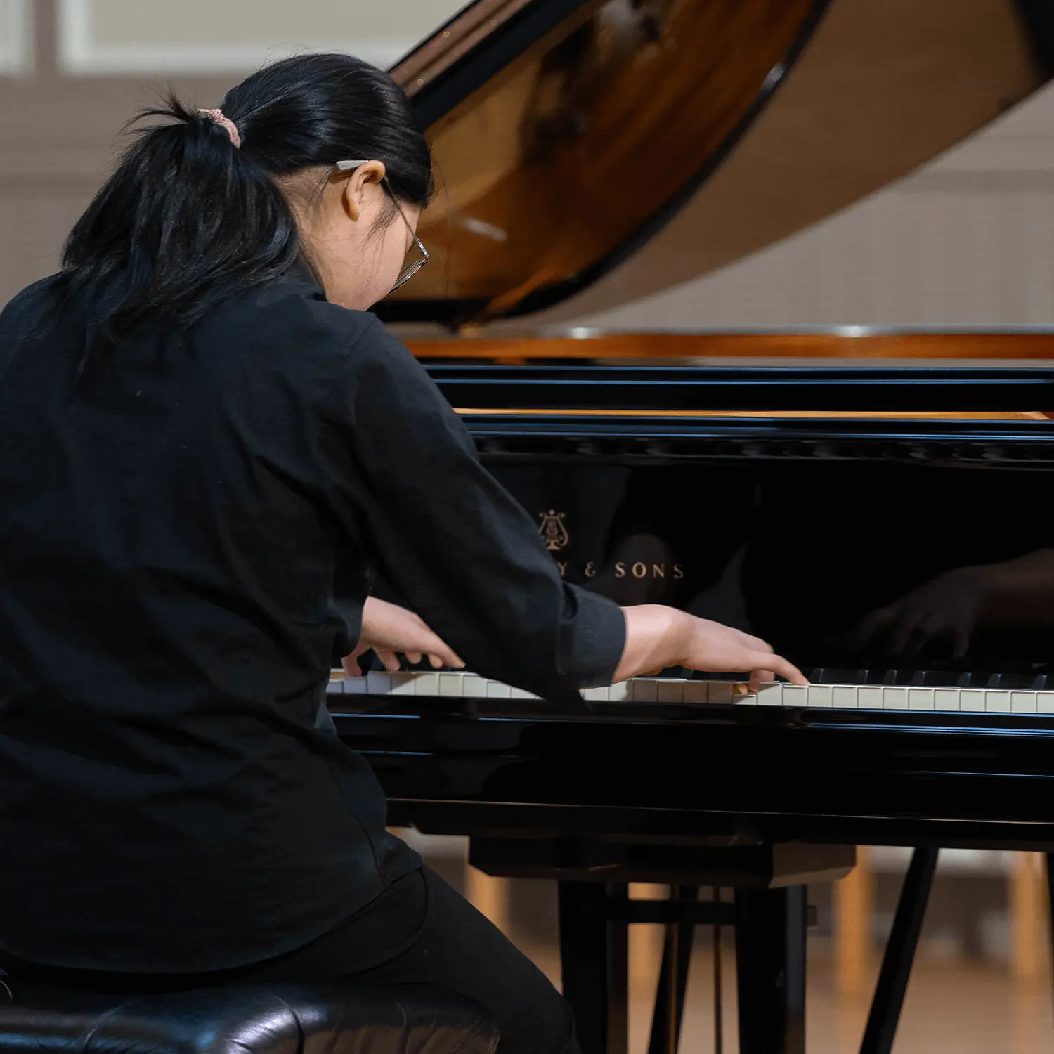 Pupil playing the piano