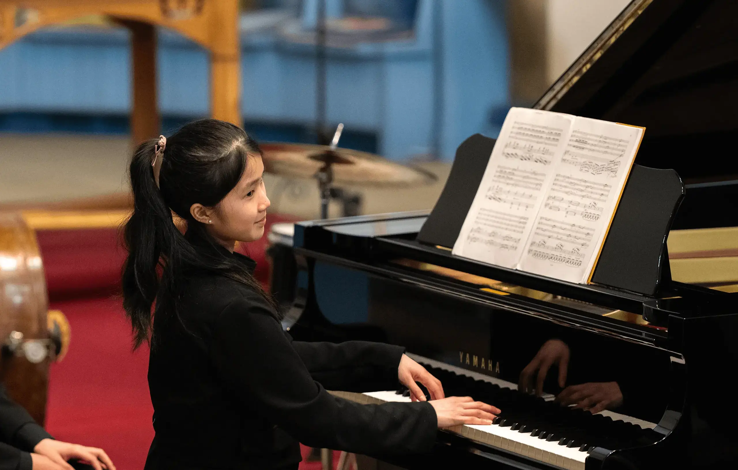 St Mary's Music School pupil playing the piano