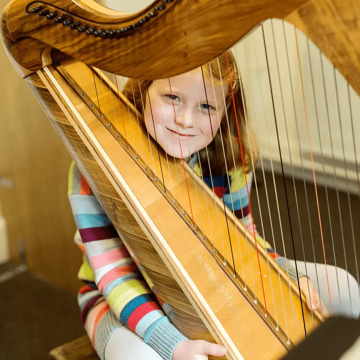 St Mary's Music School pupil plays the harp