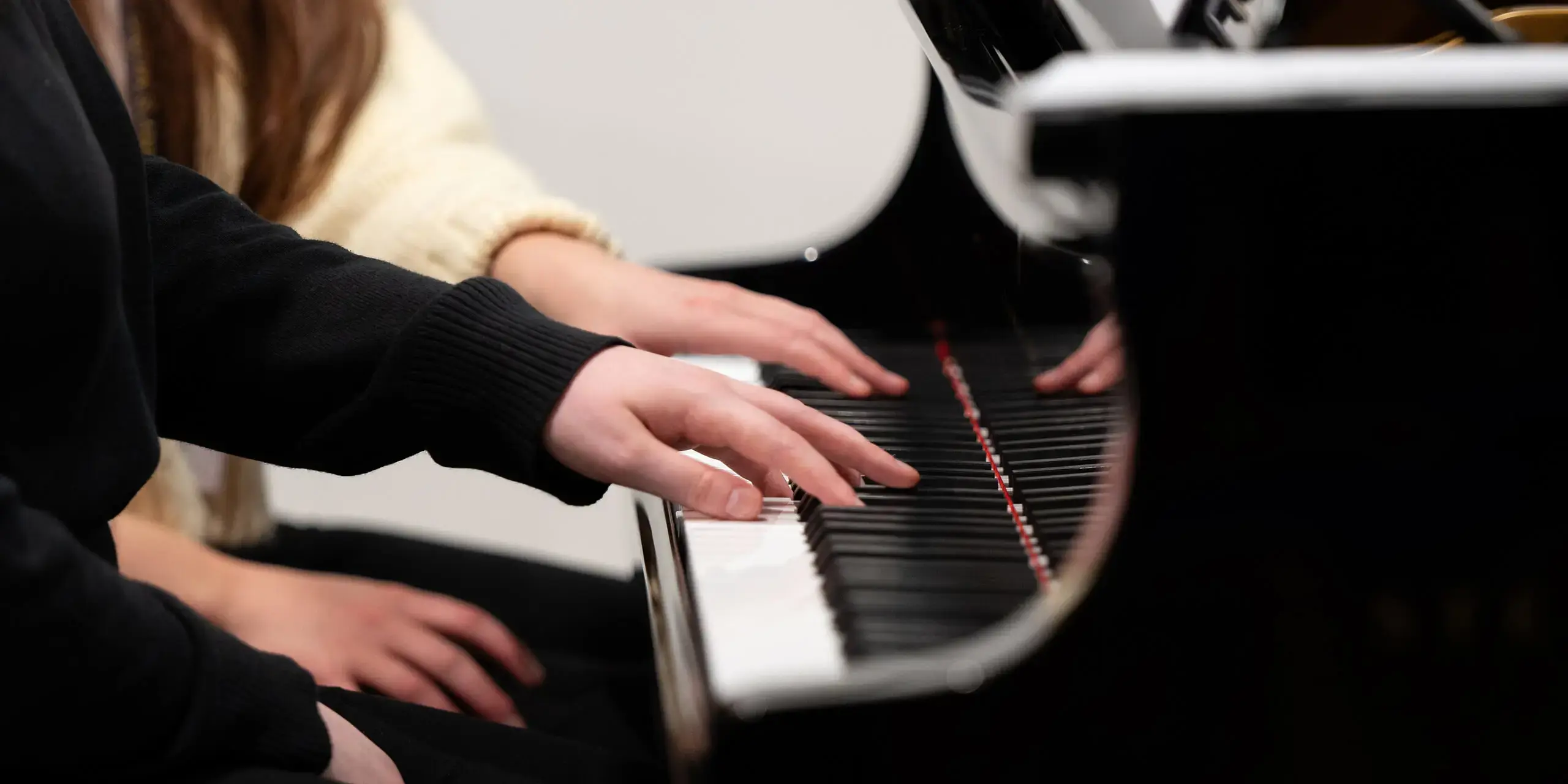 St Mary's Music School pupil and teacher playing the piano